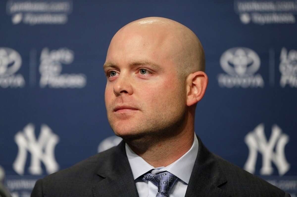 New York Yankees' Brian McCann attends a baseball news conference at Yankee Stadium in New York, Thursday, Dec. 5, 2013. McCann, an all-Star catcher, completed his $85 million, five-year contract with the team on Tuesday, in what the team called a "significant improvement to a key position." (AP Photo/Seth Wenig)