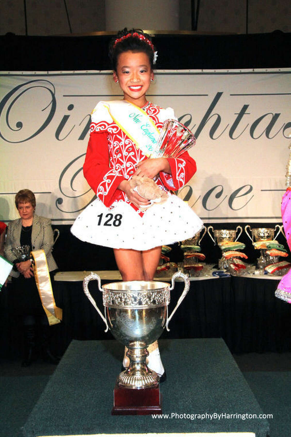 Chloe Armstrong is shown with the trophy she won at the competition.