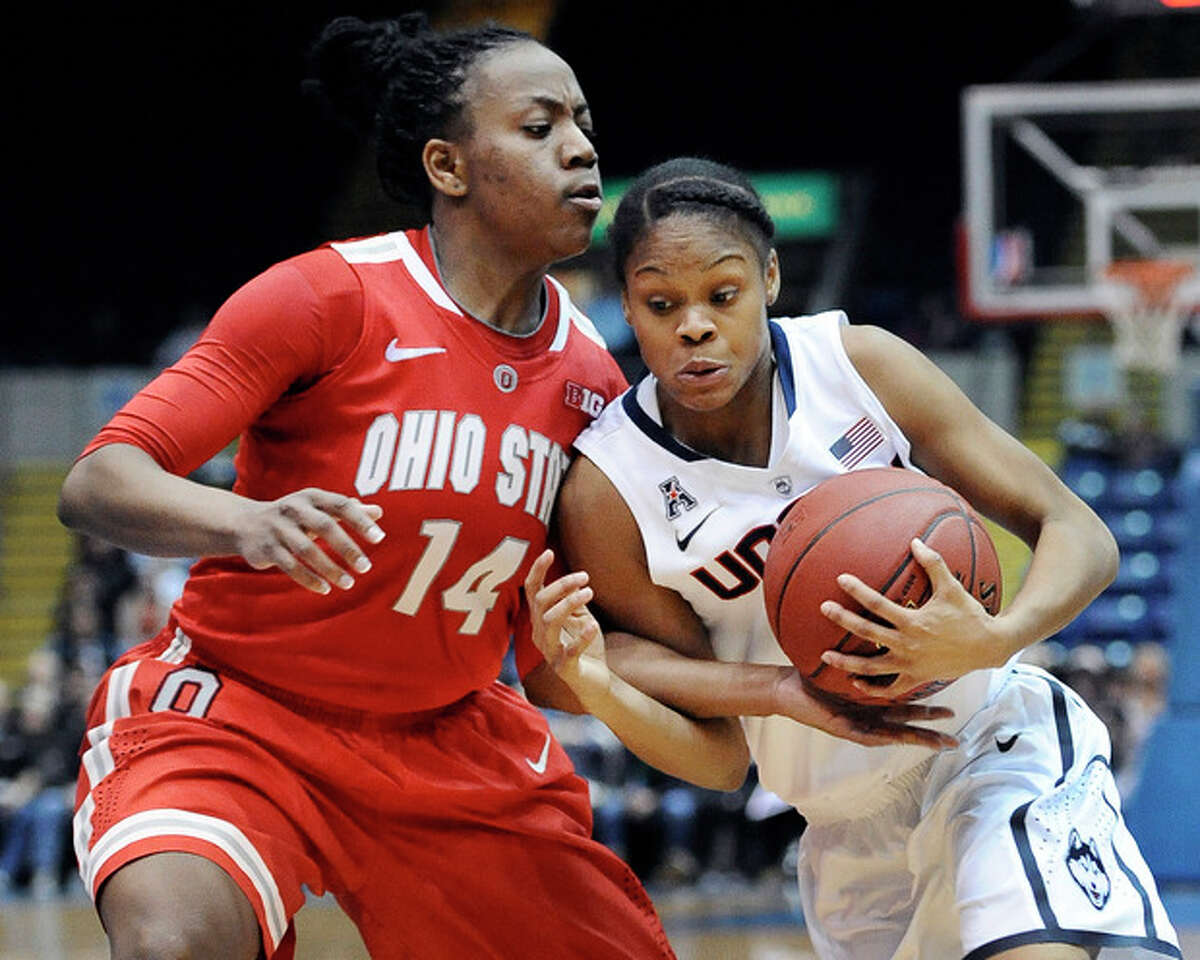 Connecticut's Moriah Jefferson, right, drives to the basket while guarded by Ohio State's Ameryst Alston, left, during the second half of an NCAA college basketball game Sunday, Dec. 1, 2013, in Springfield, Mass. Connecticut won 70-49. (AP Photo/Jessica Hill)