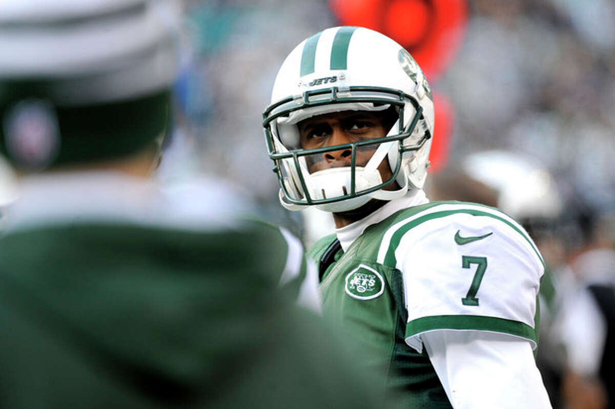 New York Jets quarterback Geno Smith looks on after being pulled during the second half of an NFL football game against the Miami Dolphins, Sunday, Dec. 1, 2013, in East Rutherford, N.J. (AP Photo/Bill Kostroun)