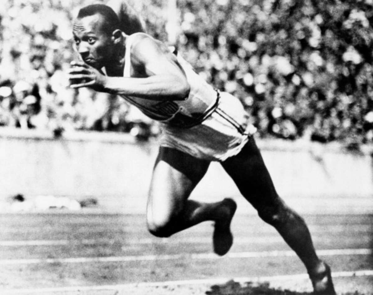 FILE -- In this Aug. 14, 1936, file photo, Jesse Owens competes in one of the heats of the 200-meter run at the 1936 Olympic Games in Berlin. One of the four Olympic gold medals won by Owens at the 1936 Berlin Games is for sale in an online auction that runs from through Dec. 7. (AP Photo/File)