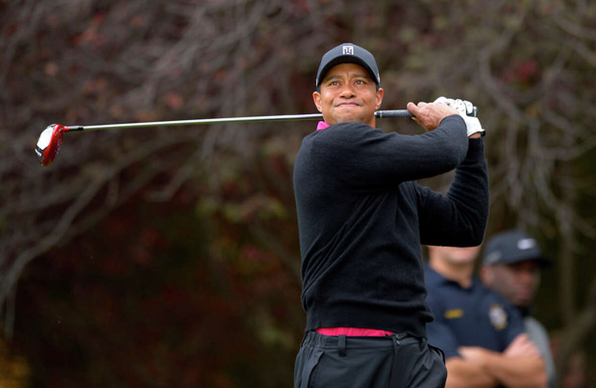 Tiger Woods tees off on the second hole during the second round of the Northwestern Mutual World Challenge golf tournament at Sherwood Country Club, Friday, Dec. 6, 2013, in Thousand Oaks, Calif. (AP Photo/Mark J. Terrill)
