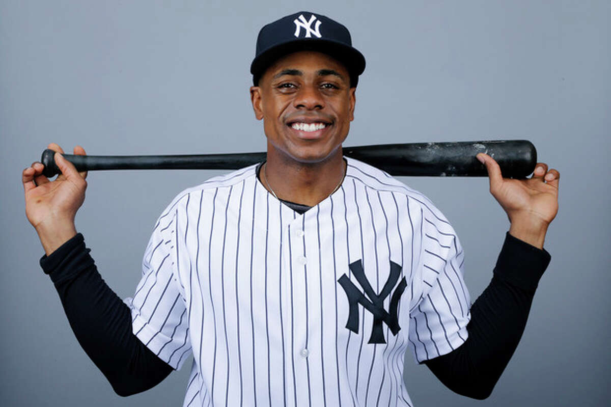 FILE - This is a 2013 photo of Curtis Granderson of the New York Yankees baseball team. A person familiar with the situation says free-agent outfielder Granderson and the New York Mets have agreed to a $60 million, four-year contract. The person spoke to The Associated Press on condition of anonymity Friday, Dec. 6, 2013, because the deal was pending a physical and no announcement had been made. (AP Photo/Matt Slocum, File)