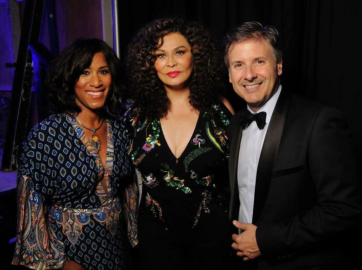 Emcees Joy Sewing, left, and Ernie Manous with honorary chair Tina Knowles