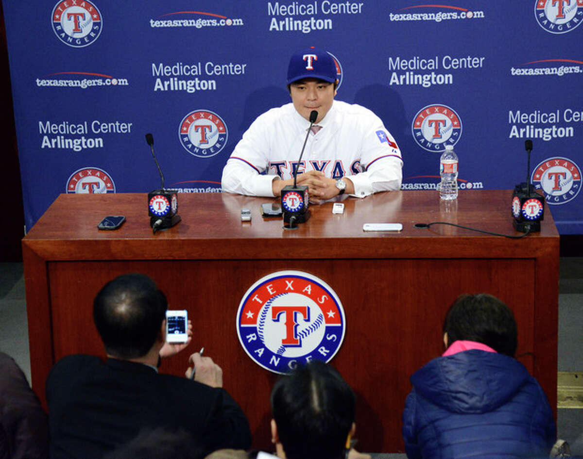 Shin-Soo Choo, of South Korea, answers questions during a news conference announcing his signing to the Texas Rangers, Friday, Dec. 27, 2013, in Arlington, Texas. Choo was signed to a $130 million, seven-year contract. (AP Photo/Tim Sharp)