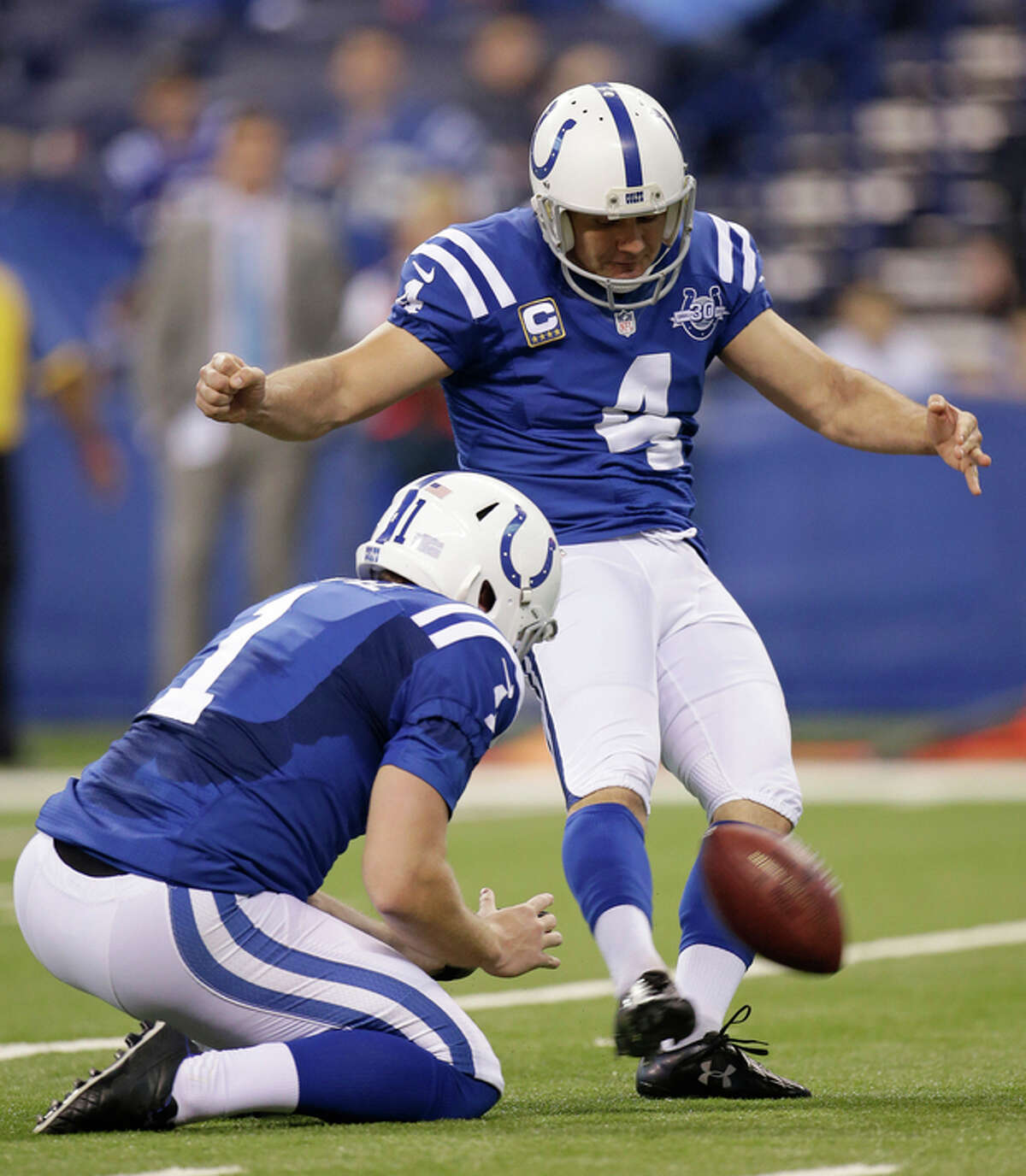 Indianapolis Colts' Adam Vinatieri (4) kicks a 23-yard field goal out of the hold of Pat McAfee (1) during the first half of an NFL football game against the Jacksonville Jaguars, Sunday, Dec. 29, 2013, in Indianapolis. (AP Photo/AJ Mast)