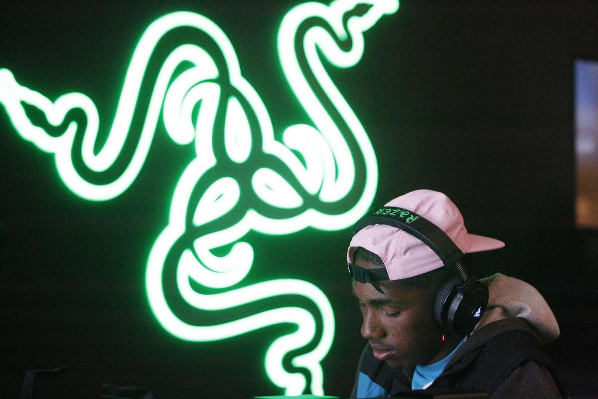 Kaizho Neely of San Fransisco places on a Razer laptop top at the Razer store on Wednesday, June 15, 2016 in San Fransisco, California.