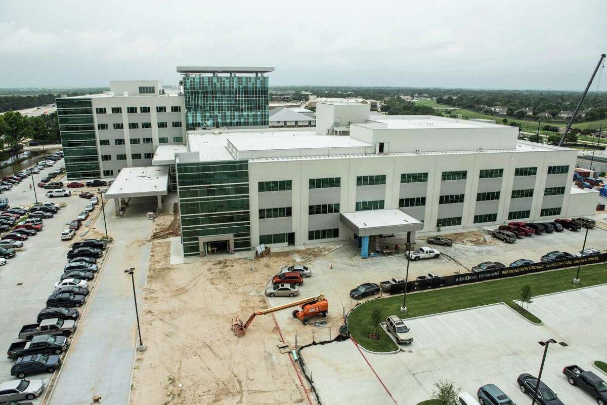 Construction crews work on building the new Memorial Hermann Cypress Acute Care Hospital on Thursday, May 26, 2016, in Houston.