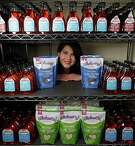 Wholesome sweetners Marketing communications Manager Holly Cassard poses for portrait with some of the companies products Friday, May 27, 2016, in Sugar Land.