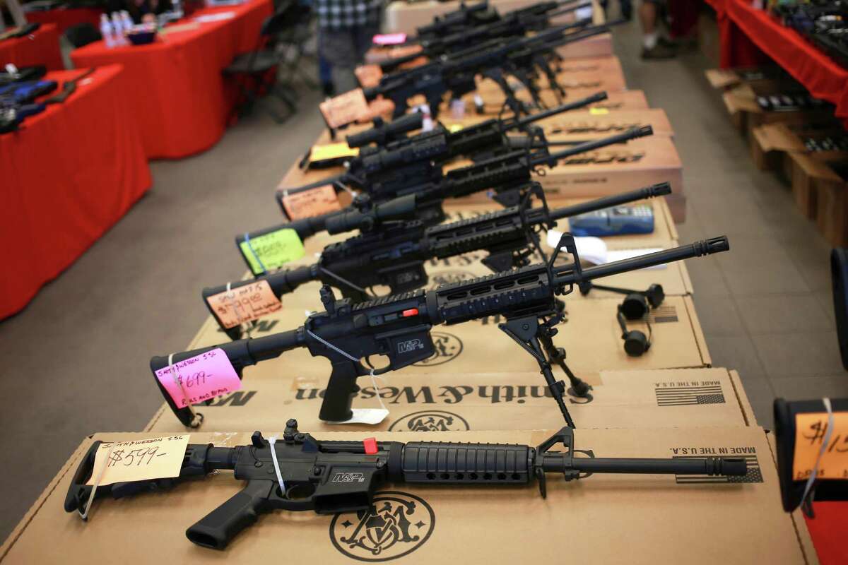 Smith & Wesson AR-15 rifles for sale at a gun show in Loveland, Colo., Oct. 11, 2014. The military-style gun, a version of which was used in the Pulse night club mass shooting that left 50 dead on June 12, 2016, has become, simultaneously, one of most beloved and most vilified rifles in the country. (Luke Sharrett/The New York Times)