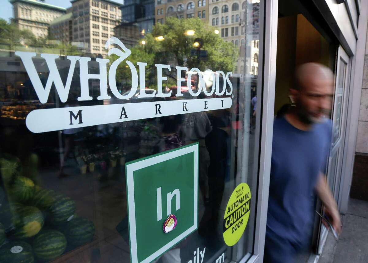 In this June 24, 2015 file photo, a shopper leaves a Whole Foods Market store in Union Square, in New York. Shares of Whole Foods Market slumped nearly 10 percent the week of June 13, 2016, following revelations that the Food and Drug Administration is concerned about unsanitary conditions at a plant in the northeast.