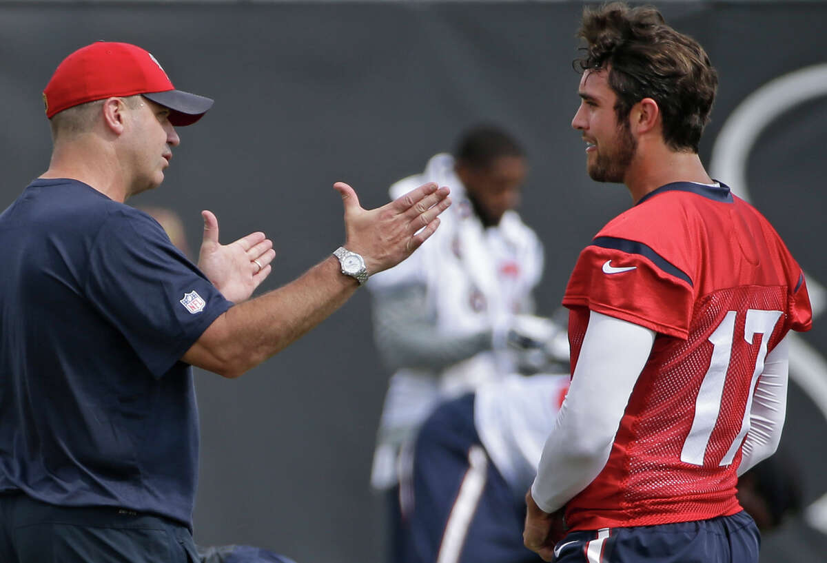 Texans coach Bill O'Brien, left, talks strategy with quarterback Brock Osweiler during offseason workouts at NRG Park on June 10. In Osweiler, O'Brien gains a quarterback who has had a long list of influences on his football development.