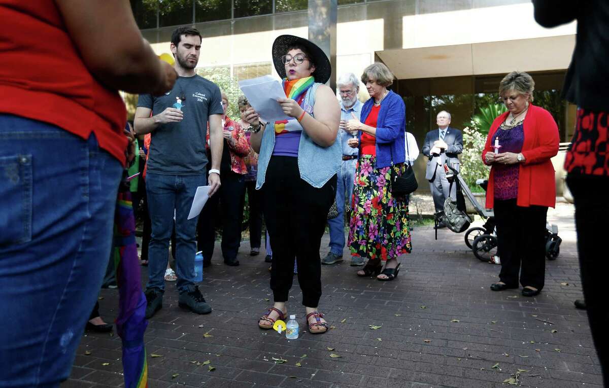 University of Houston Clear Lake student, Genesis Granados, reads aloud the names of the 49 victims of the Orlando nightclub shootings during a candlelight vigil for the victims, at the UHCL campus, Thursday, June 16, 2016, in Clear Lake. The Office of Intercultural Student Services put on the event, as part of the Women's and LGBT Services.