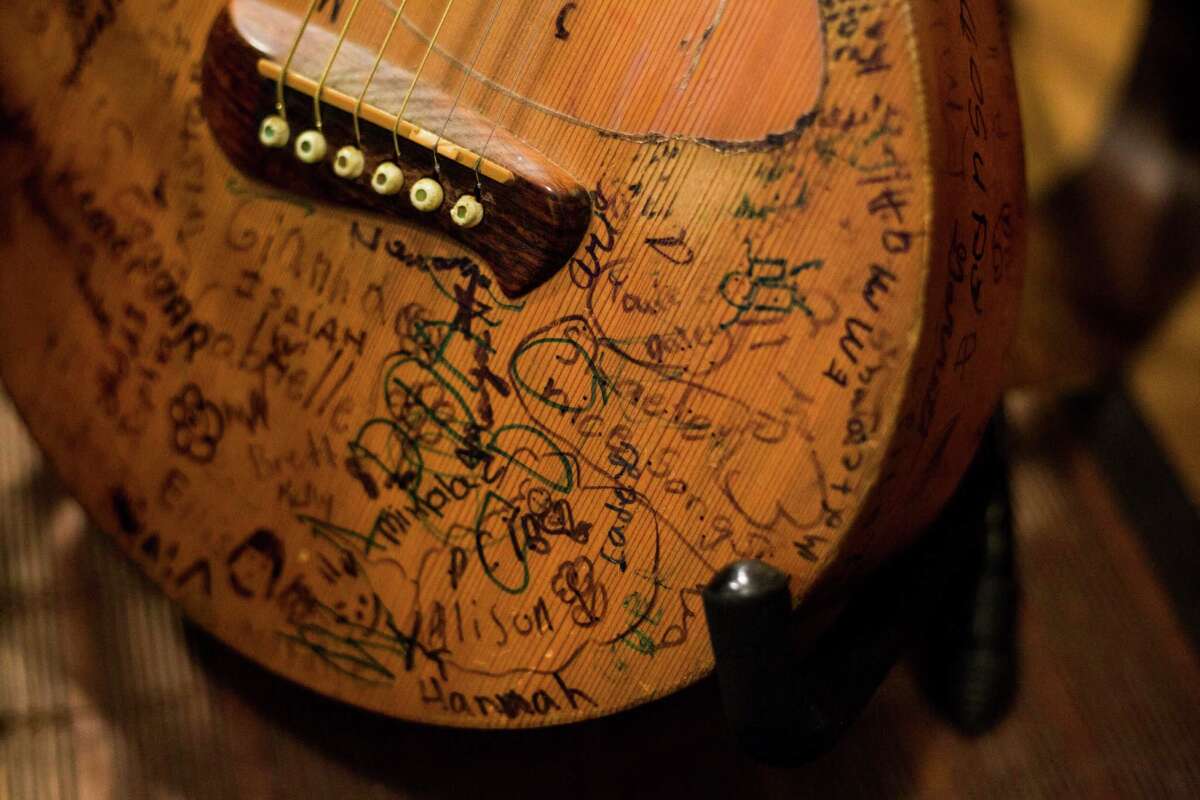 A guitar signed by children sits in the San Marcos home of Terri Hendrix. Hendrix is set to release “Slaughterhouse Sessions,” the second of a five-album project.