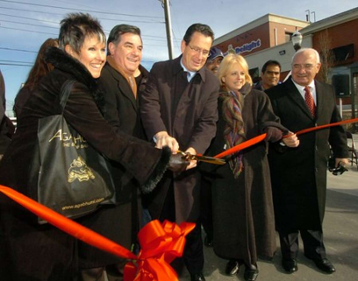 Photo/Alex von Kleydorff. Agabhumi owner Regina Kirshbaum, Mayor Mike Pavia, Governor Elect Dan Malloy, Mary Beth Mello,Regional Administrator, Federal Transit Administration and Director of Operations Ernie Orgera cut the ribbon on the improved Jefferson St part of the Urban Transitway project in Stamford