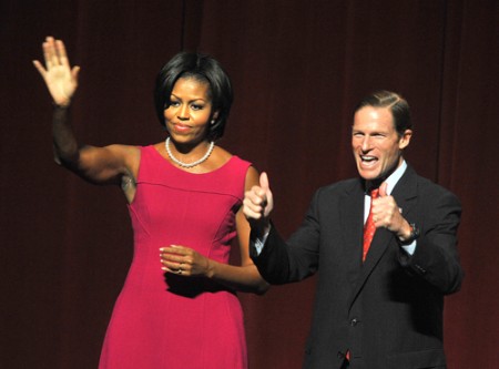 First lady urges voters 'to finish what we started'