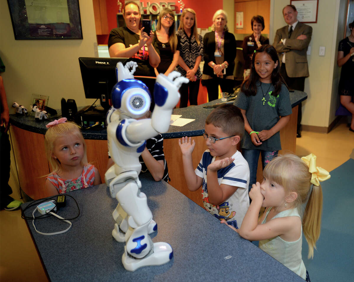 St. Elizabeth's newest piece of technology walks and talks through the pediatrics hallway during an unveiling on Thursday. Named C.H.A.M.P., the knee high robot is designed to distract children from the stress of being hospitalized. Photo taken June 16, 2016 Guiseppe Barranco/The Enterprise