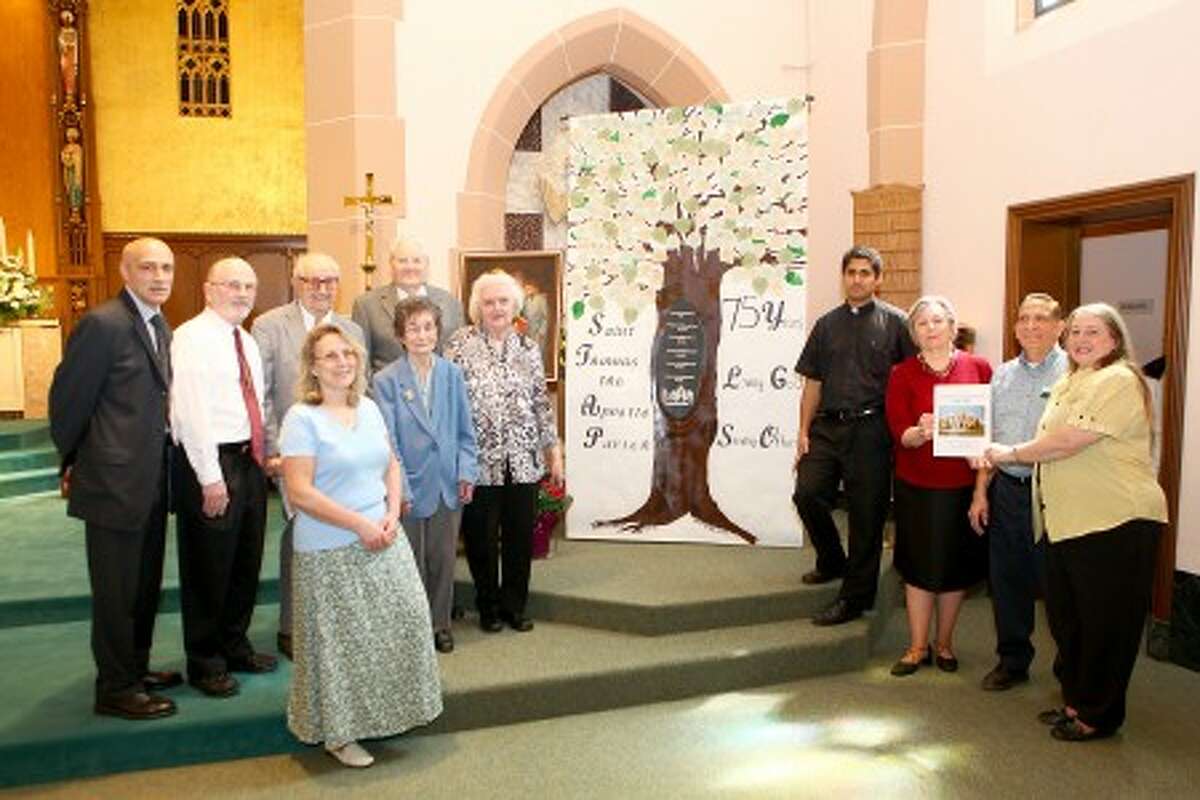 Vincent Irrera, Deacon Joe Gagne, A. William Harrik an usher of 80 years, Henry and Margaret Simon, Karen Gasper, Carm Pagliano, Father Sudhir D''Souza, Mary Ann Schmotzer, Lou Siladi and Alice Prunotto gather for a photo before a celebration mass honoring the 75 year anniversary of St. Thomas the Apostle Parish Sunday morning. DAVID ESPOSITO / Hour photo