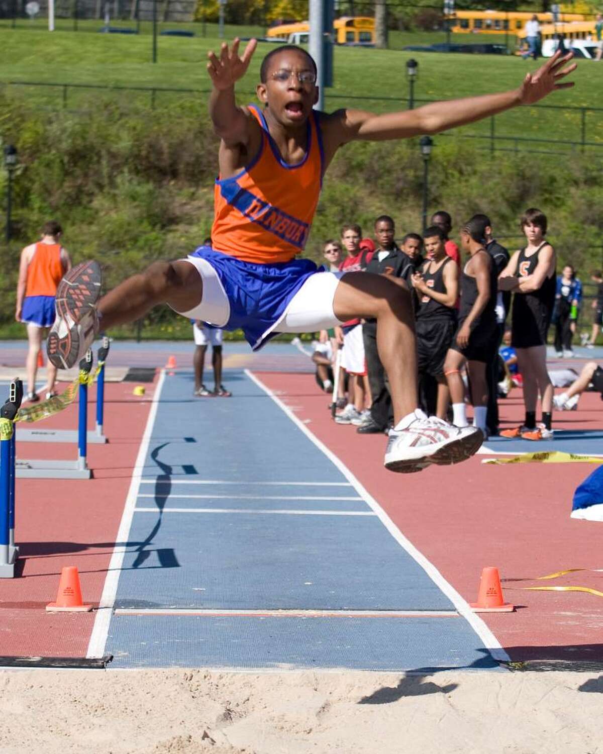 Danbury's Xavier Jones long jumps during competition in the O'Grady Relays Saturday at Danbury High.