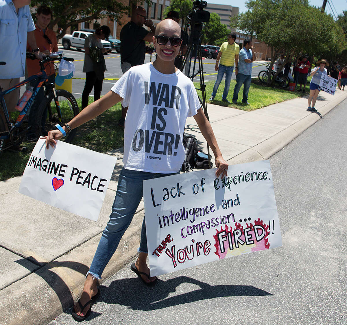 Hundreds of demonstrators assembled for Republican presidential candidate Donald Trump's visit to San Antonio, gathering near his private fundraiser at Oak Hills Country Club on June 17, 2016