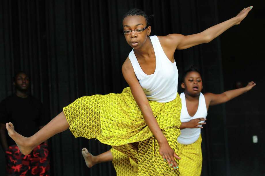 Jynnae Stevens, 11, left, and Jahnasia Gardner, 9, perform with the dance troop Umoja during the 14th Annual Celebration of Juneteenth on Saturday, June 21, 2014, at Central Park in Schenectady, N.Y. Juneteenth is the oldest known celebration commemorating the end of slavery in the United States. (Cindy Schultz / Times Union) Photo: Cindy Schultz / 00027124A