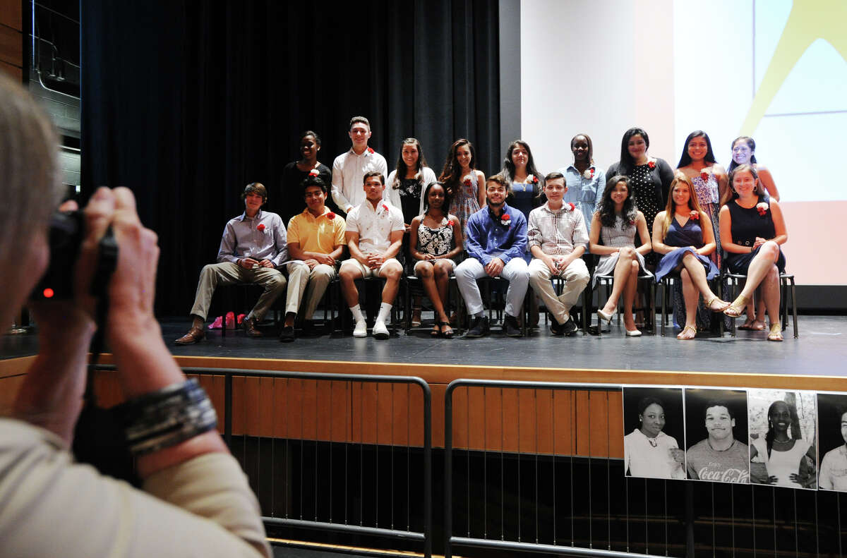 Greenwich High School seniors who participated in the AVID college-readiness program have their group photo taken during the AVID recogntion ceremony in the auditorium at the school in Greenwich, Conn., Thursday night, June 16, 2016.