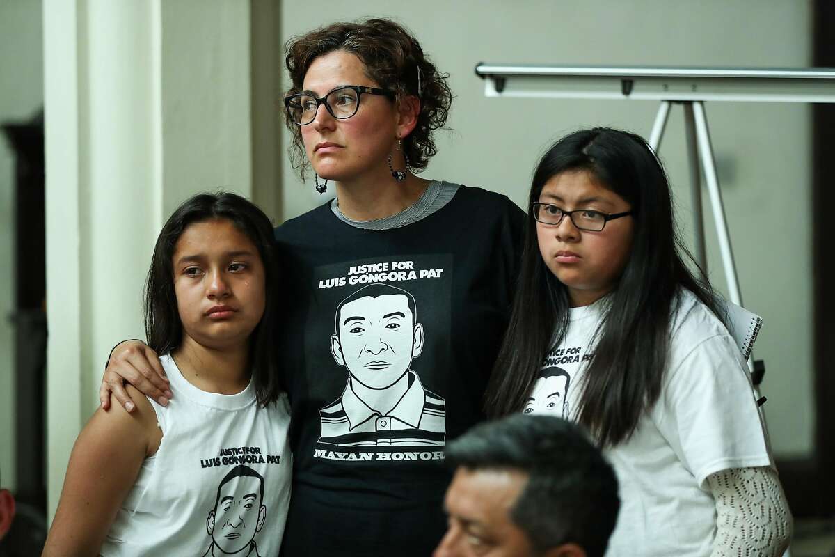 (left) Nadia Diaz, 11 and Evelyn Poot, 11 (right), both cousins of Luis Gongora Pat are comforted by Adriana Camarena (center) during a press conference announcing the filing of a claim against the city and county of San Francisco for the April 7, 2016 shooting and death of Luis Gongora Pat, in San Francisco, California, on Friday, June 17, 2016.