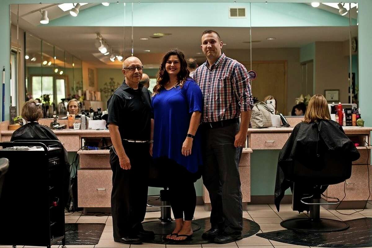 ERIN KIRKLAND | ekirkland@mdn.net From left, former owner Nathan Torres and current owners Krystal and Jeff Zienert pose for a photo on Wednesday at Nathan's Hair Unlimited. The salon recently celebrated its 40th anniversary.