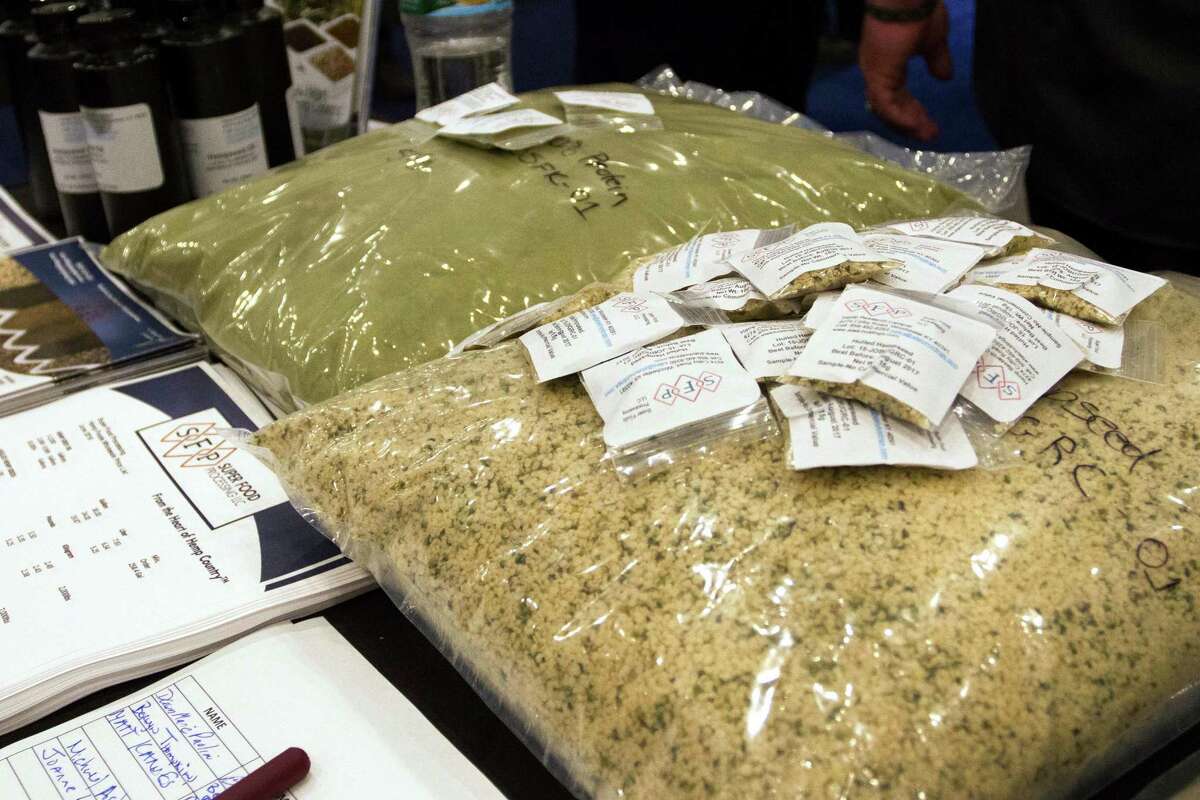 Bags of hemp seeds are displayed on a table next to promotional material at the Cannabis World Congress and Business Exposition, Friday, June 17, 2016 in New York. The three-day conference at New York City's Jacob K. Javits Convention Center was a gathering of professionals and advocates from nearly every facet of the emerging marijuana industry. (AP Photo/Ezra Kaplan)