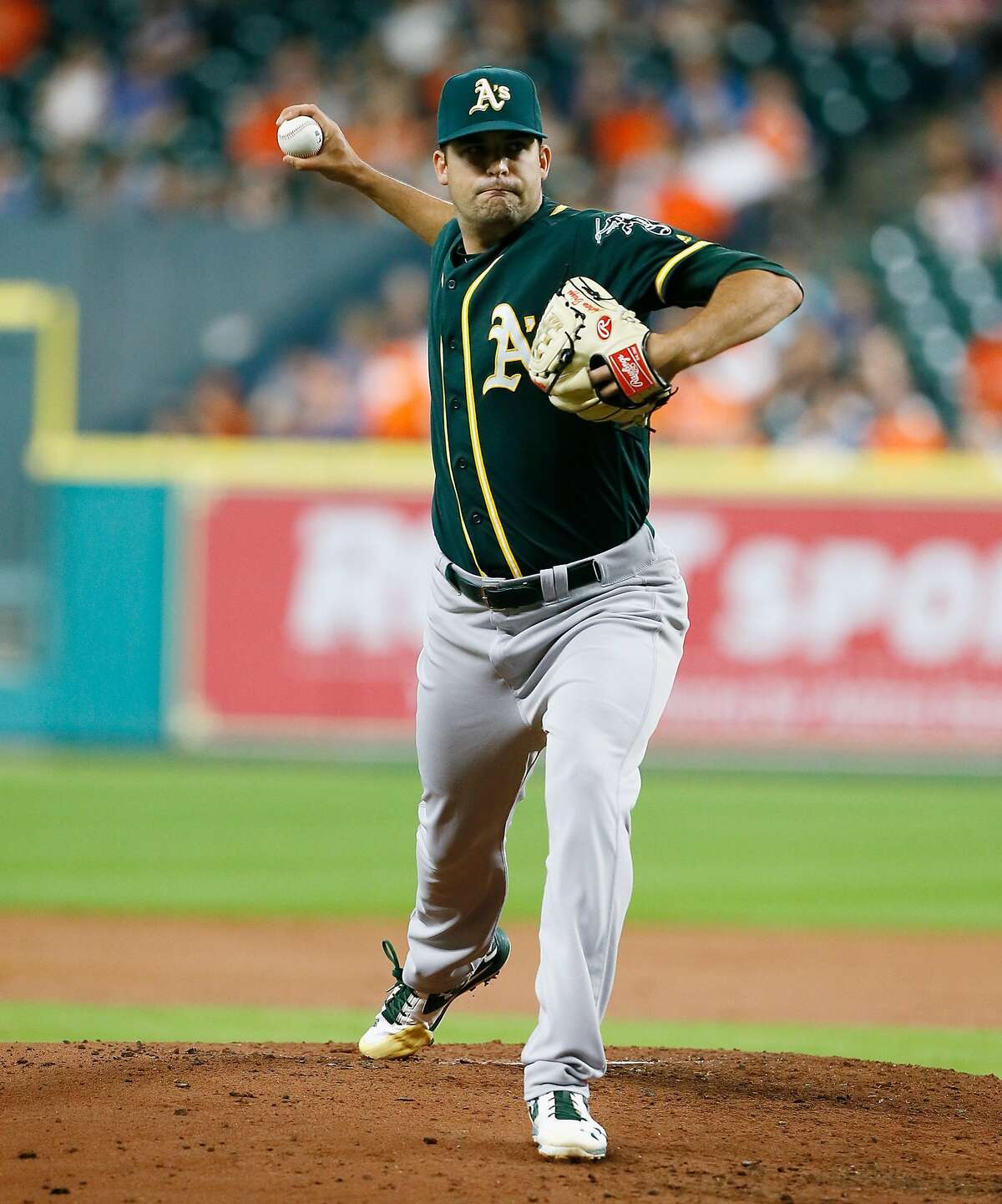 HOUSTON, TX - JUNE 03: Andrew Triggs #60 of the Oakland Athletics pitches in the first inning against the Houston Astros at Minute Maid Park on June 3, 2016 in Houston, Texas. (Photo by Bob Levey/Getty Images)