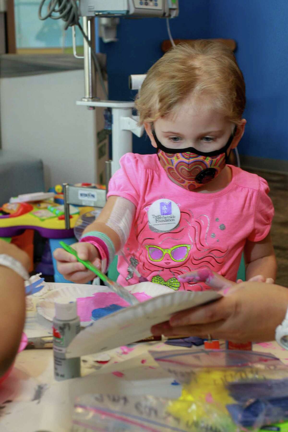 Evie Reed, 5, doing Animal Arts and Crafts at Camp Periwinkle Days. Camp Periwinkle Days transforms the Texas Children's Cancer and Hematology Centers waiting rooms into a two-day camp with games, prizes and activities to enrich the lives of some 500 children challenged by cancer under care at the hospital in Houston on June 17, 2016.