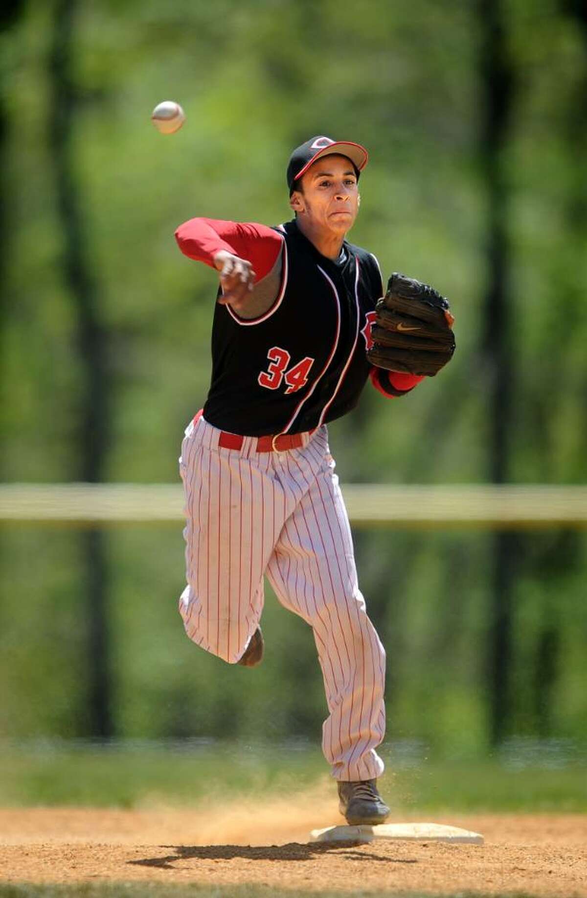Central's Santos Canales throws to first for the out Saturday Apr. 24, 2010 during the Bridgeport Baseball Classic against Harding at Veteran's Memorial Field.