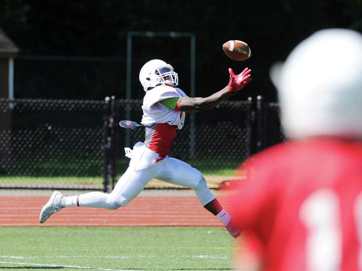 Receiver James Day of the white team makes a first quarter catch for a touchdown on a pass from quarterback Connor Langan during the annual 2016 Greenwich High School spring Red & White football game at the school in Greenwich, Conn., Saturday, June 18, 2016.