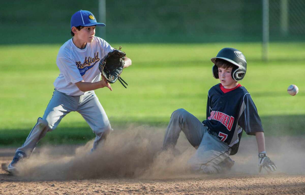Ryan Gilroy of the New Fairfield Rebels slides safely into second during a game against the Brookfield Blue Jays played at the Huckleberry Hill School, Brookfield, CT on Friday, June 17, 2016. Members of the Rebels will play for the Thundercats who will be going to Cooperstown, NY in August.
