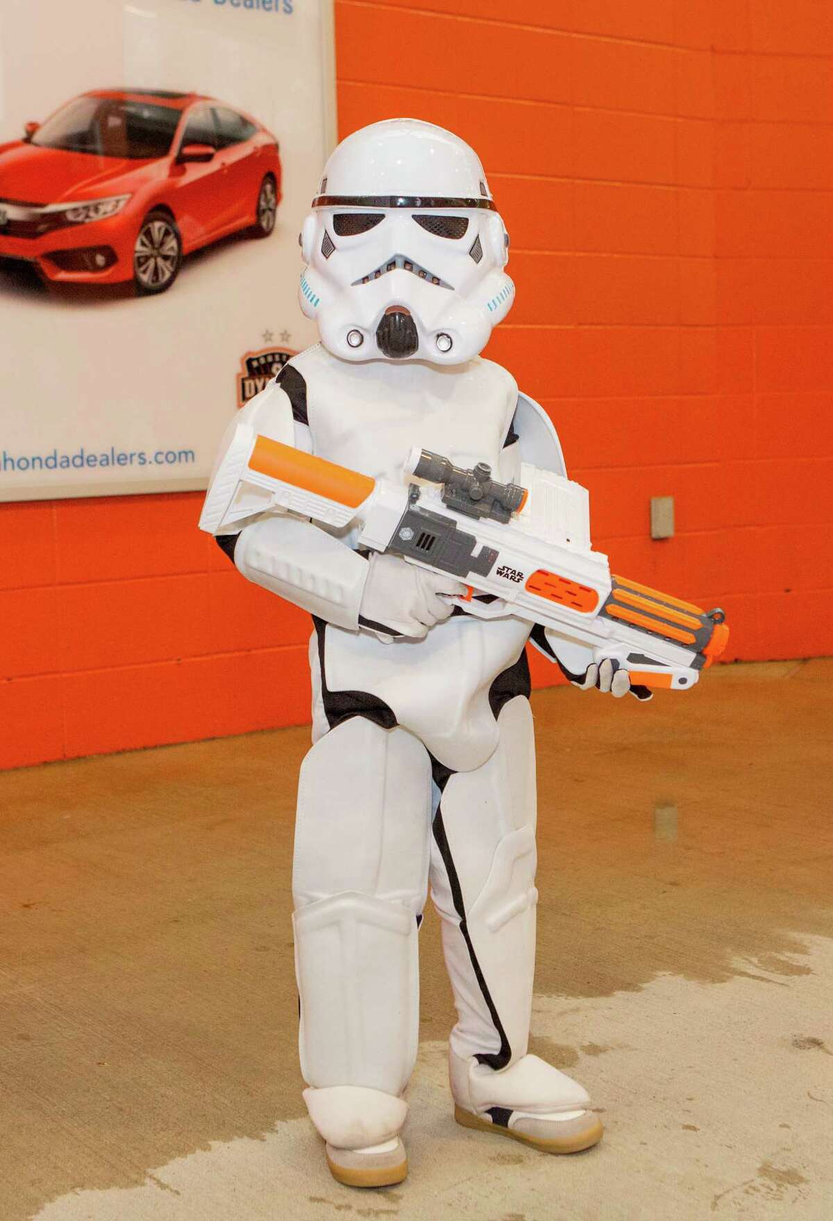 Julian Celesto in a Storm Trooper costume posing for a photo before the first half of action between the Houston Dynamo and the D.C. United during a soccer game at BBVA Compass, Saturday, June 18, 2016, in Houston. ( Juan DeLeon / for the Houston Chronicle )
