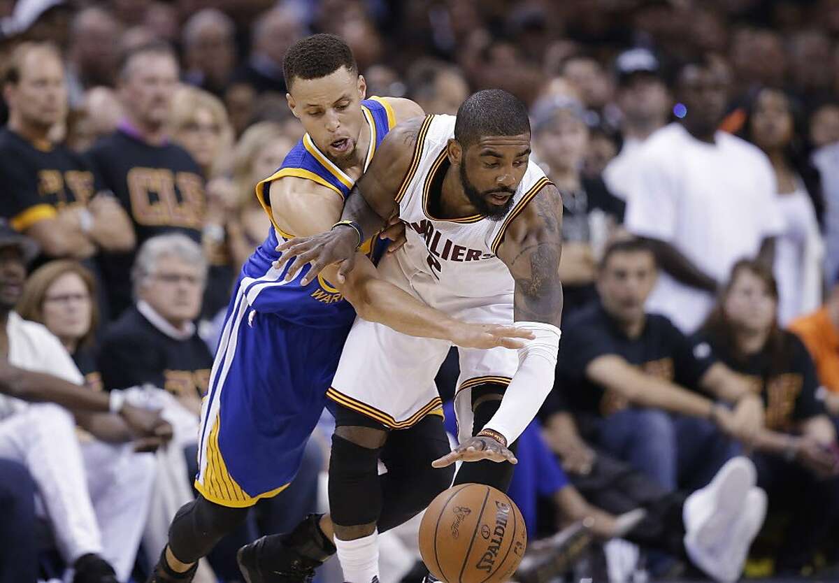 Golden State Warriors guard Stephen Curry (30) reaches against Cleveland Cavaliers guard Kyrie Irving (2) during the first half of Game 6 of basketball's NBA Finals in Cleveland, Thursday, June 16, 2016. (AP Photo/Tony Dejak)