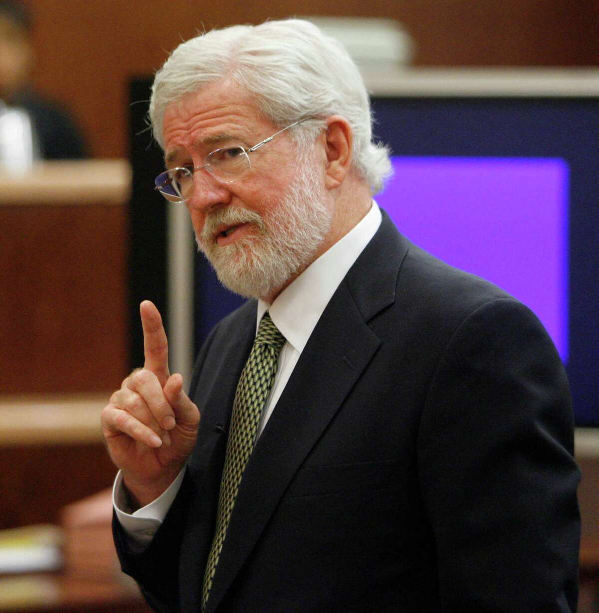 George Parnham, attorney for Andrea Yates, gestures during the closing arguments in Yates' trial Monday, July 24, 2006, in Houston. Jurors began deliberating in Andrea Yates' second murder trial Monday to determine if she knew that drowning her five children in the bathtub was wrong. (AP Photo/Brett Coomer, Pool)