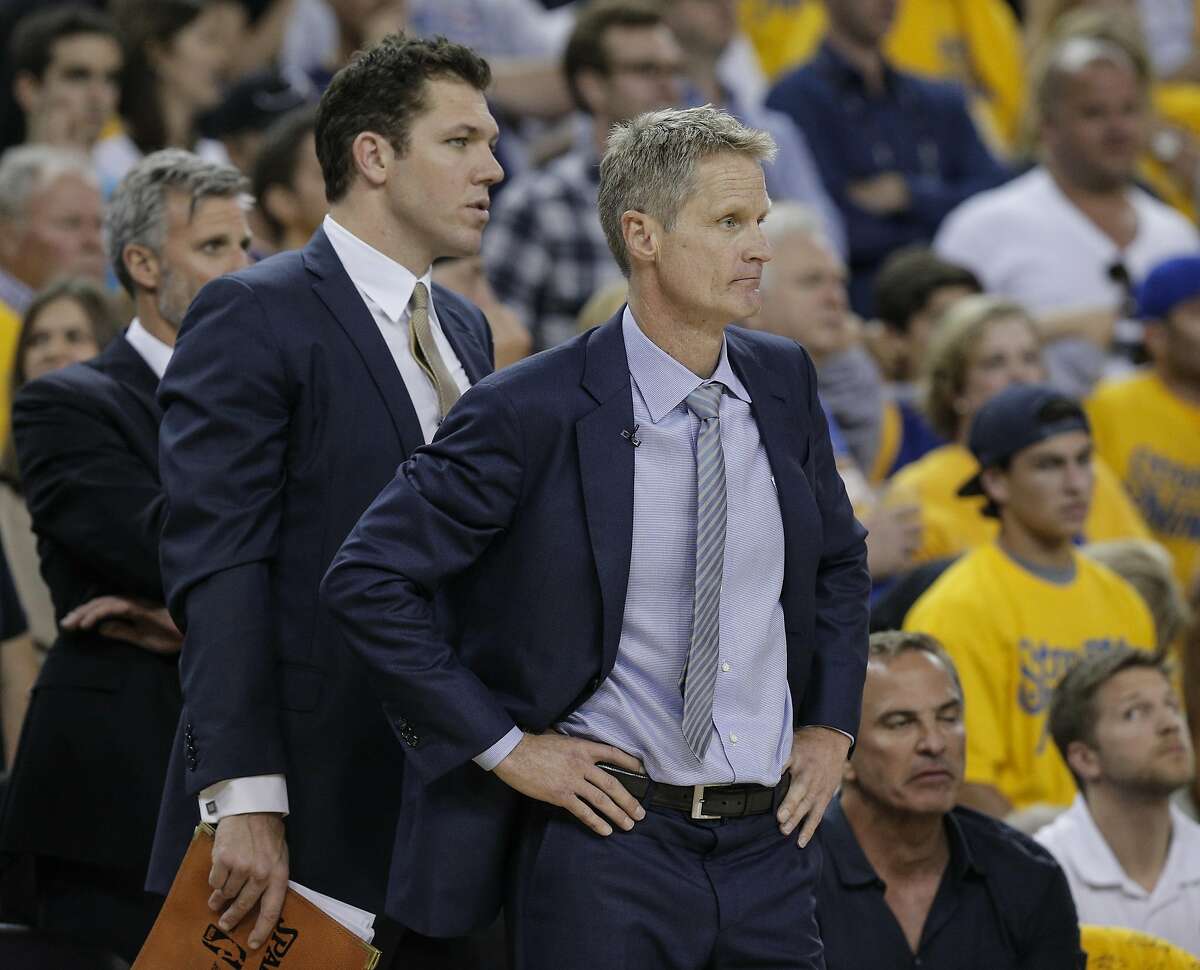Golden State Warriors' Coach Steve Kerr and assistant coach Luke Walton watch the fourth quarter during Game 7 of the NBA Finals at Oracle Arena on Sunday, June 19, 2016 in Oakland, Calif. The Cleveland Cavaliers defeated the Golden State Warriors 93 to 89 to win the NBA Championship.