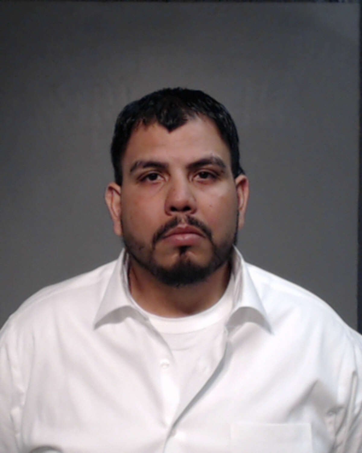 Angel de la Mora, 32, pleaded guilty to two counts of official oppression Monday.