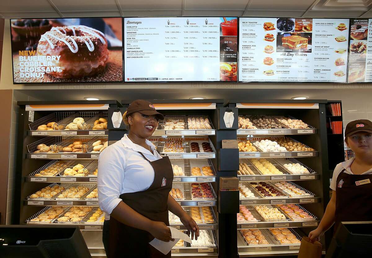 Crew members Blair Stanford (left) and Sammie Berkson (right) work at Dunkin' Donuts during a media preview on Monday, June 20, 2016, in Walnut Creek, Calif.. The Bay Area's very first Dunkin' Donuts shop is opening on Wednesday.