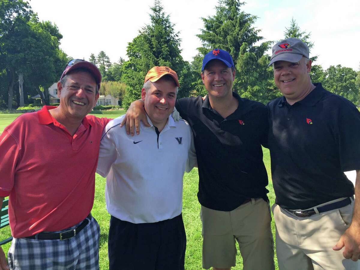 From left, program supporters Adam Cohen, Frank Ingarra and captains dads Dan Kraninger and Barry Williams particpate in the 16th annual Cardinal Quarterback Club Fundraising Golf Outing Monday at Greenwich Country Club.