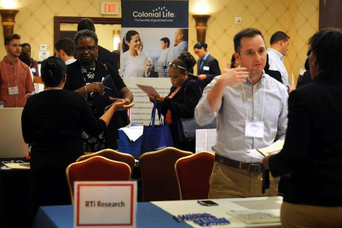 Job candidates make the rounds on June 10, 2016 at the RecruitCT Job Fair in Trumbull, Conn. Average weekly earnings in Connecticut spiked to their highest level in 10 years, with the state Department of Labor cautioning the gain was likely a statistical anomaly introduced during random survey samples. (Photo: Ned Gerard)
