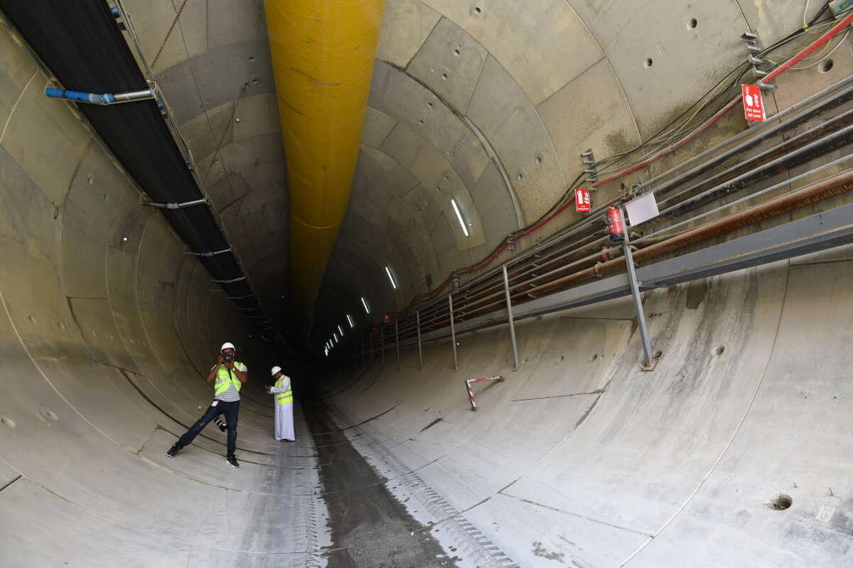 A Saudi photographer takes pictures in a tunnel on May 4, 2016 during a visit at a construction site of a section of the Saudi capital Riyadh's $22.5 billion metro system. The system, which will have six lines covering 176 kilometres (109 miles), supported by a bus network of 1,150 kilometres, is due to be completed by the end of 2018. Deputy Crown Prince Mohammed bin Salman announced a long-term reform programme, dubbed "Vision 2030", marking the beginning of a hugely ambitious attempt to move Saudi Arabia beyond oil, the backbone of its economy for decades. / AFP PHOTO / FAYEZ NURELDINEFAYEZ NURELDINE/AFP/Getty Images