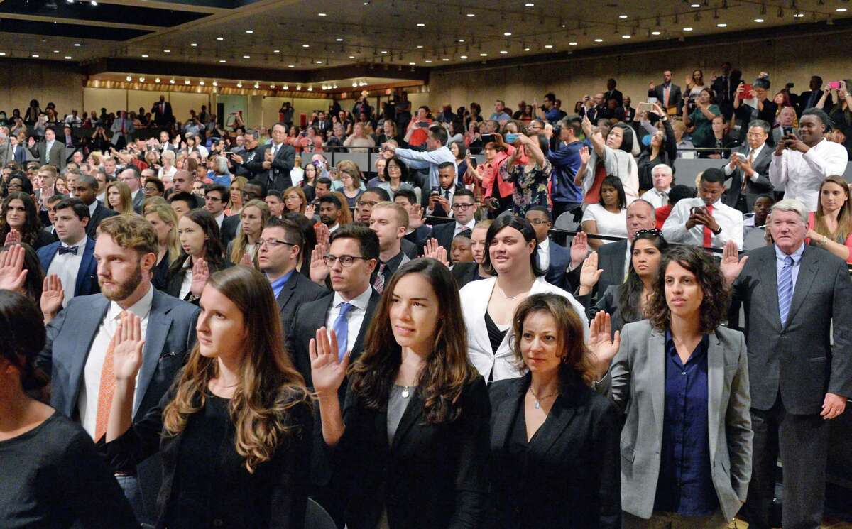 704 new lawyers are sworn-in to the New York Bar Association during a ceremony on Wednesday, June 22, 2016, at the Empire State Plaza Convention Center in Albany, NY. All of the new attorneys passed the state Bar examination or satisfied the motion admission requirements and were approved for admission by the Third Department?s Committees on Character and Fitness. (John Carl D'Annibale / Times Union)