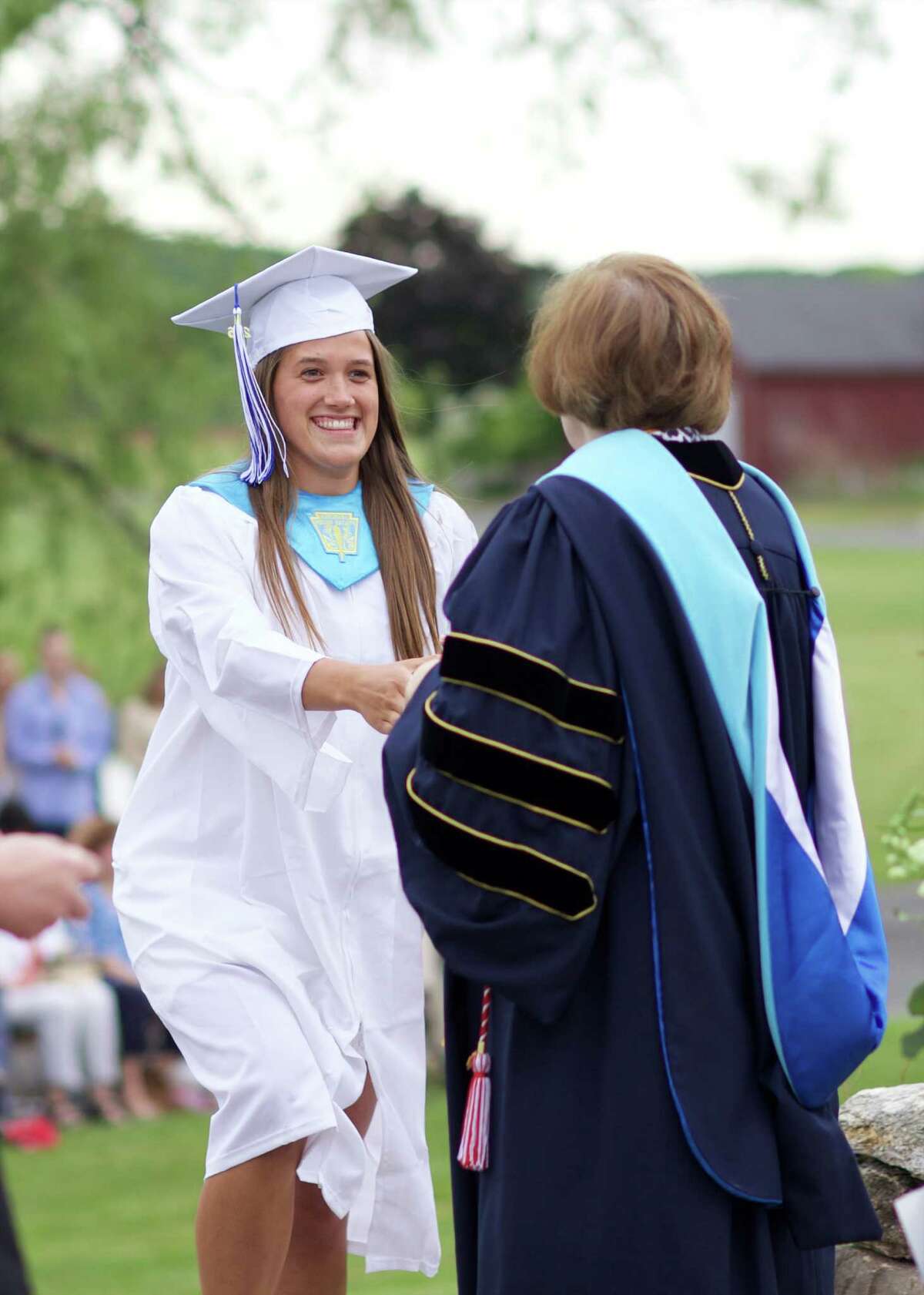 Shepaug Valley School valdictorian Haley Pesce receives her diploma.
