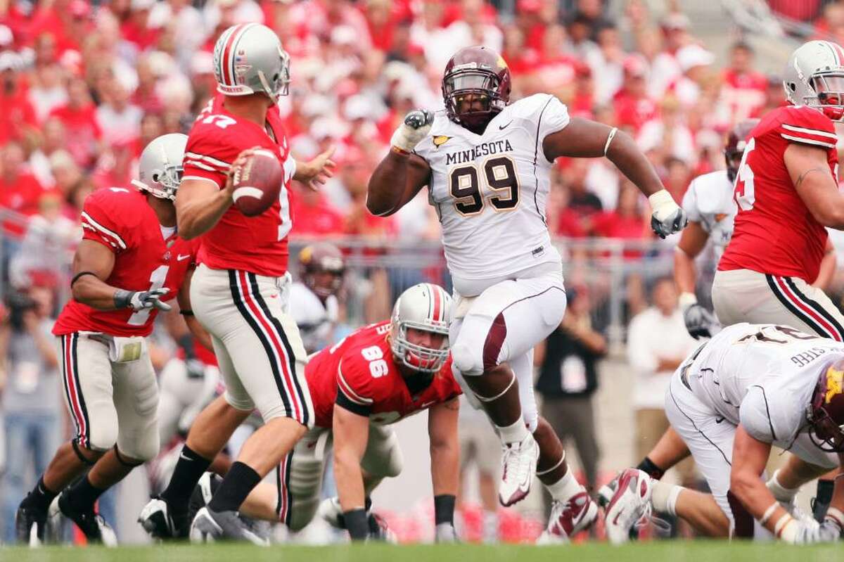 COLUMBUS, OH - SEPTEMBER 27: Minnesota Golden Gopher defensive tackle Garrett Brown #99 rushes in on Ohio State Buckeyes quarterback Todd Boeckman #17 on September 27, 2008 at Ohio Stadium in Columbus, Ohio. The Buckeyes defeated the Golden Gophers 34-21. (Photo by Jamie Sabau/Getty Images) *** Local Caption *** Garrett Brown; Todd Boeckman
