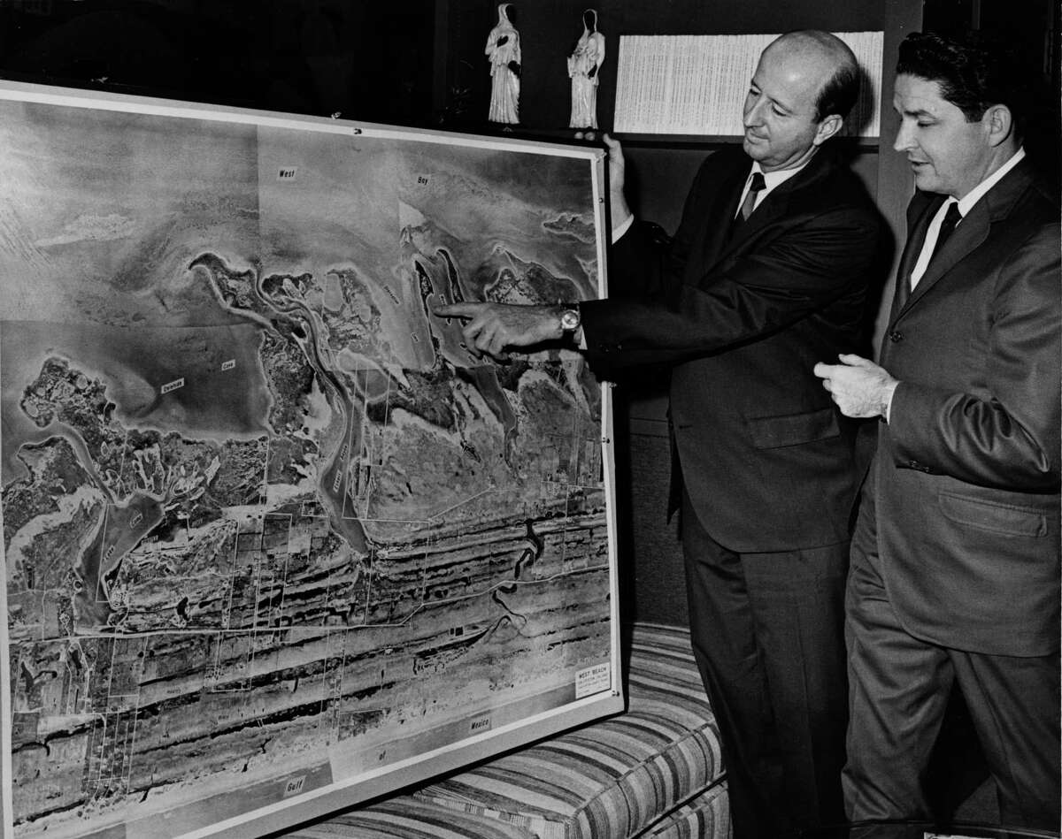 George Mitchell points to a Pirates Cove project on a map to Norman Dobbins, of Pace Setter Homes in 1967.