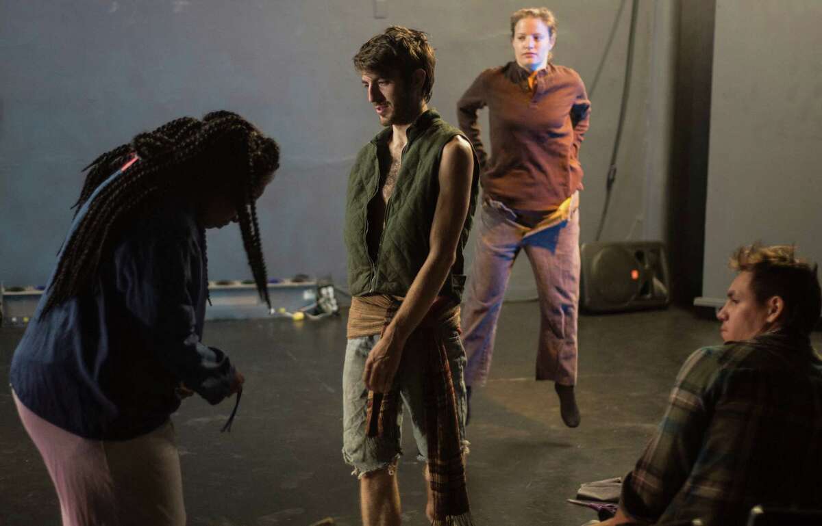 Christina Hawkins, left adjusts a costume as Stephan Gaeth director, Sophie Bolles, back right, and Michael Martinez look on during rehearsal. Jump-Start's INKubator program, a new initiative to help artists create new work, has its first product. Stephan Gaeth's "Asking for Change" deals with homelessness.