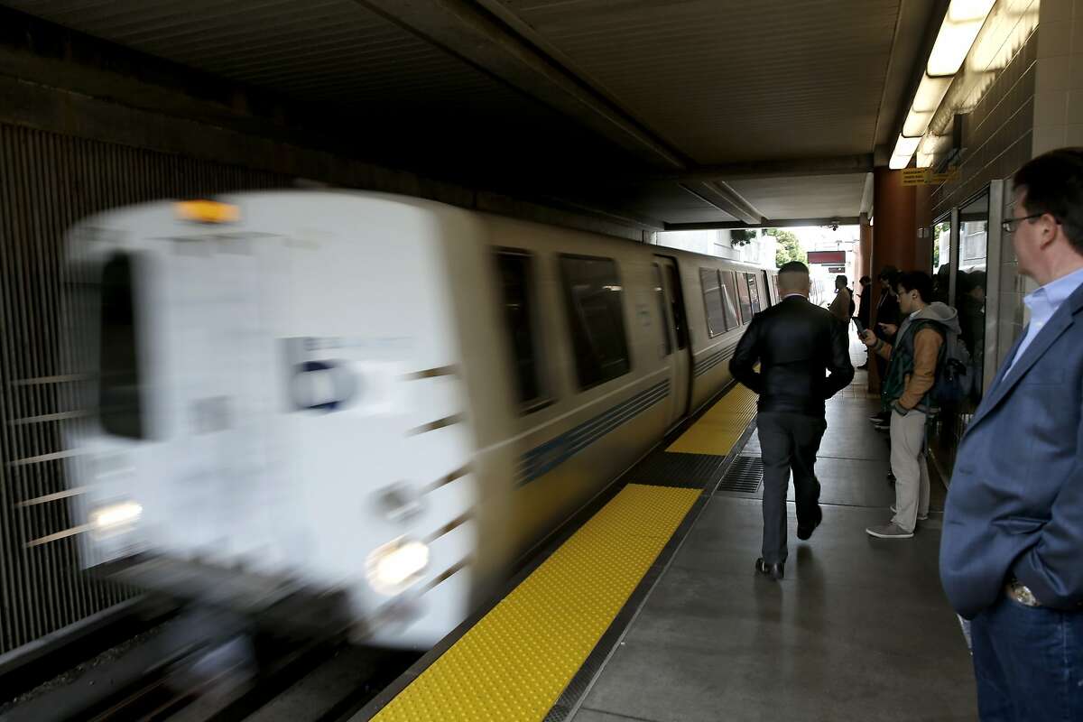 A BART train pulls into the Millbrae station along the BART system in San Francisco, California, on Thurs. June 23, 2016. BART is unveiling its system for fining passengers who take up more than a single seat on a train.