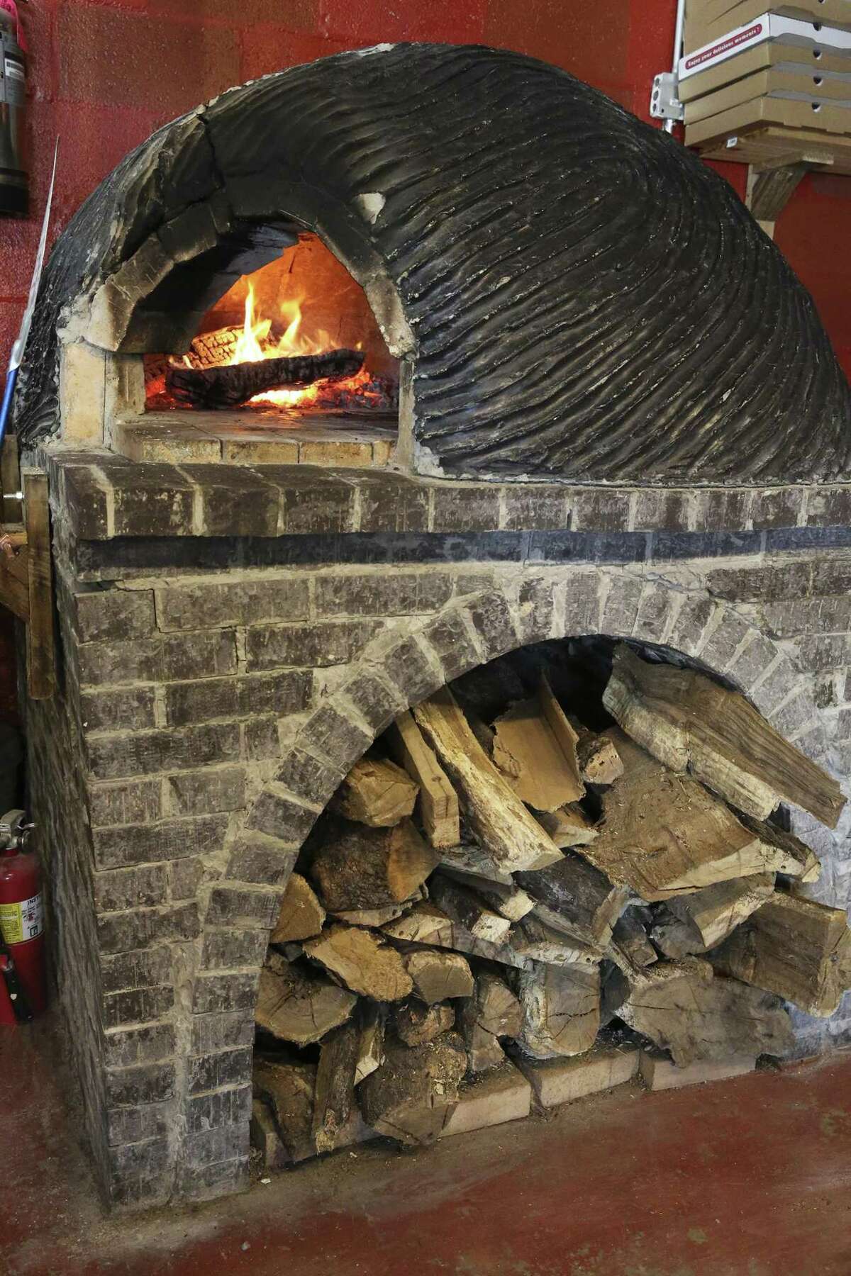 The brick oven built by chef/owner Michael Sohocki stands as the focal point of Il Forno.